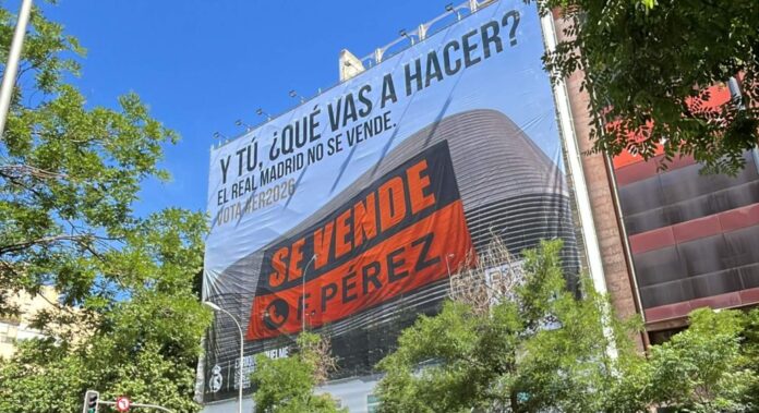 Enrique Riquelme coloca una lona gigante con foto del Santiago Bernabéu en un edificio de Madrid atacando a Florentino: 